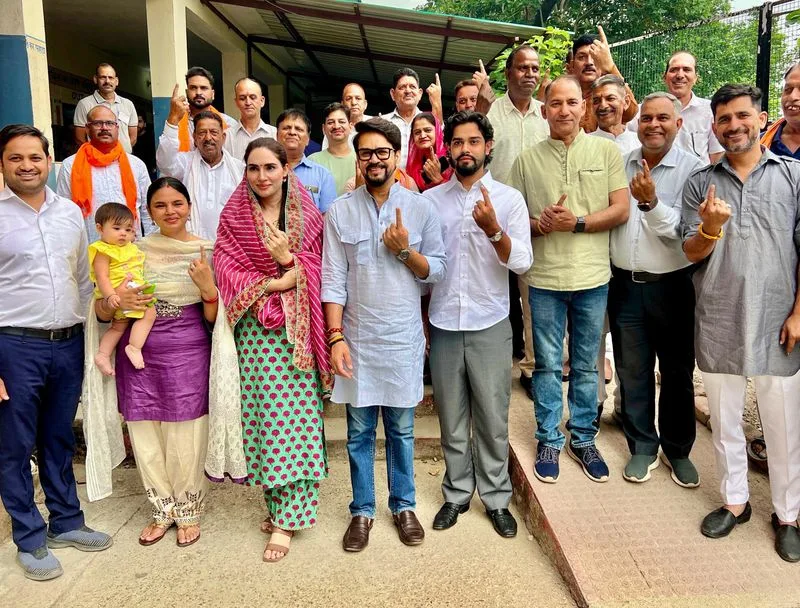 Dhumal, Anurag Thakur cast vote at Sameerpur